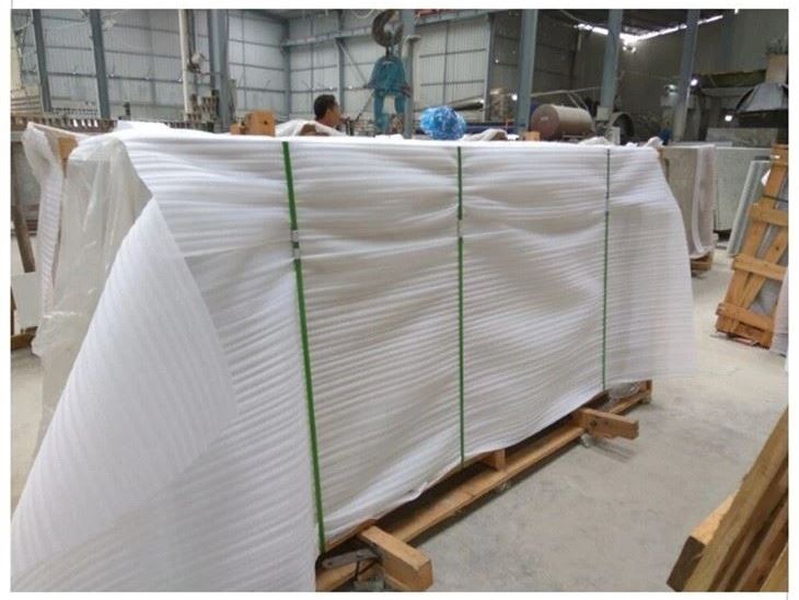 Granite countertop pieces protected and bundled for project packing